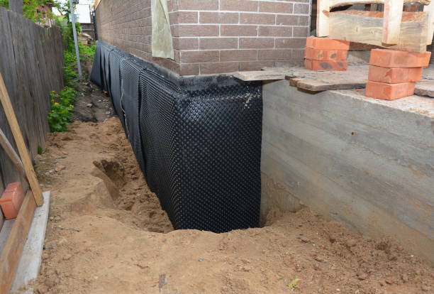 Happy homeowners after waterproofing job in Thorn Hill